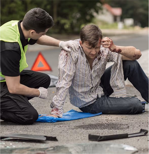 Paramedic helping an injured man after personal injury case in Pharr.