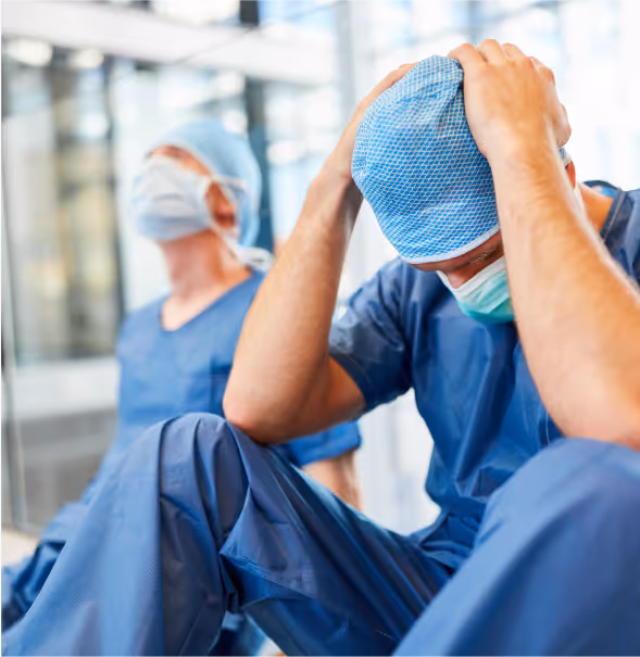 Surgeons resting in a hospital hallway after medical malpractice in Pharr.