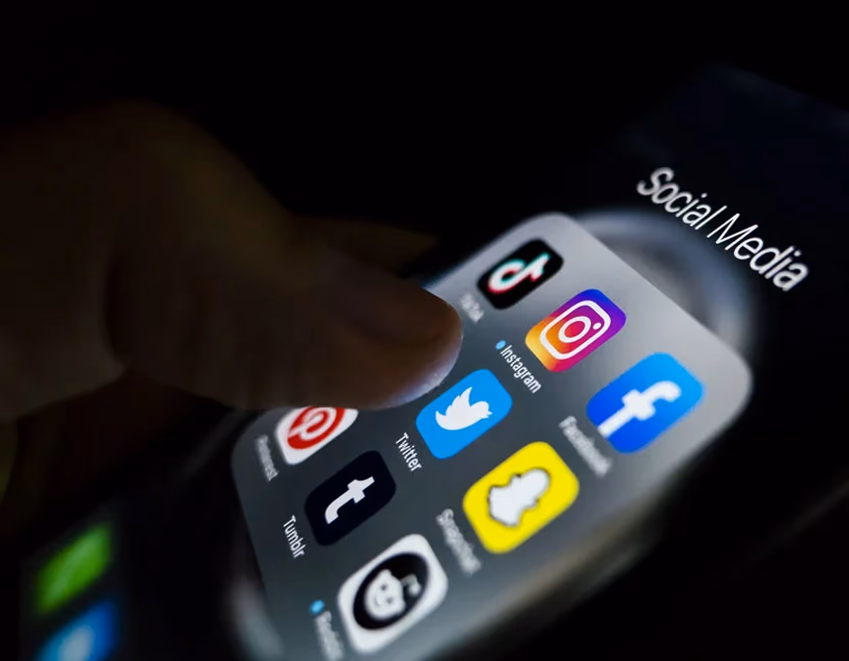 Smartphone showing social media apps linked to personal injury case risks.