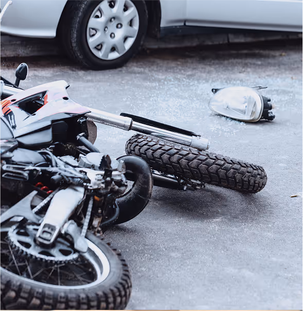 Damaged motorcycle on road after motorcycle accident.