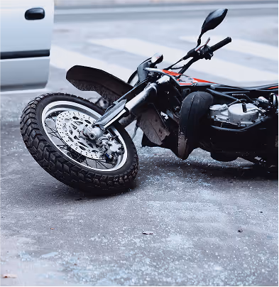 Motorcycle lying on road after rear-end collision.