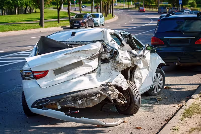 Driver opening a beer bottle behind the wheel before DUI accident.
